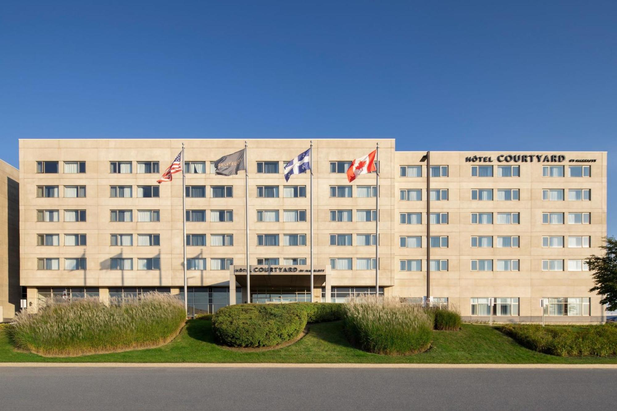 Отель Courtyard By Marriott Montreal Airport Дорваль Экстерьер фото